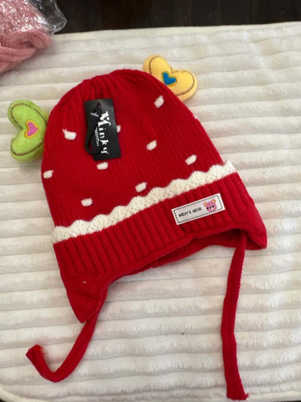 Kids red knit hat with white polka dots and white scalloped trim